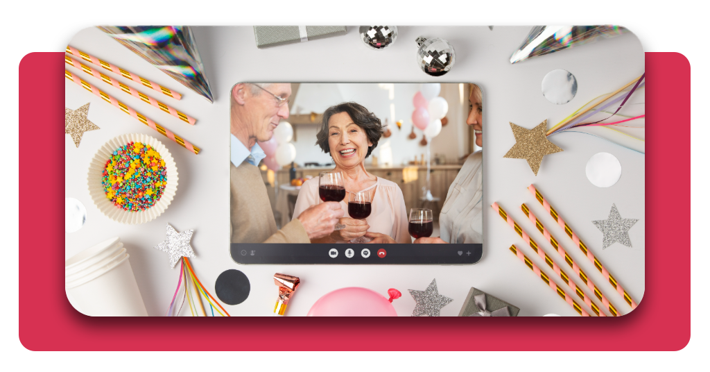 Vista superior de la planificación y el diseño de una tarjeta digital interactiva en una pantalla, perfectamente rodeada de coloridas decoraciones de fiesta.